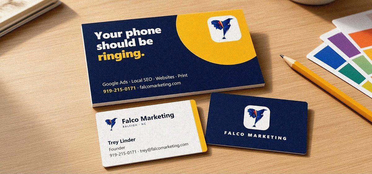 Direct mail postcard and business cards on an oak desk