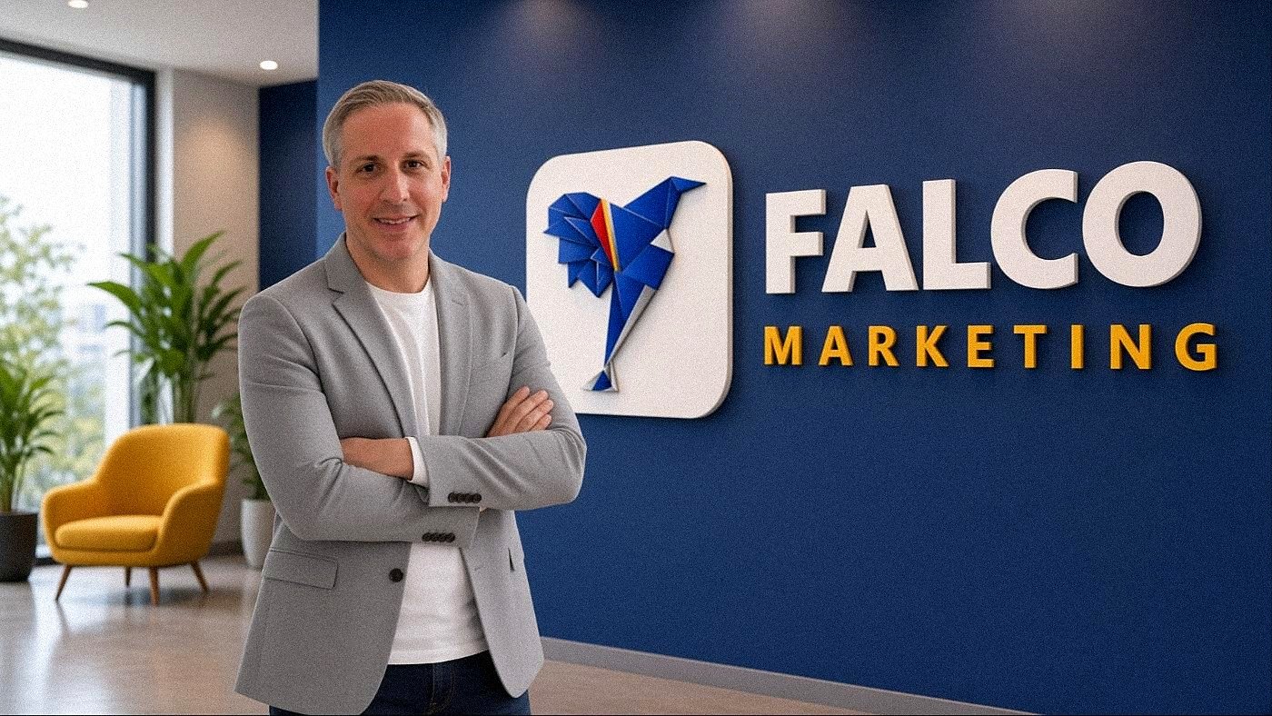 Trey Linder, founder, beside the Falco Marketing sign