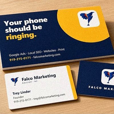 Falco Marketing postcard and business cards on a desk